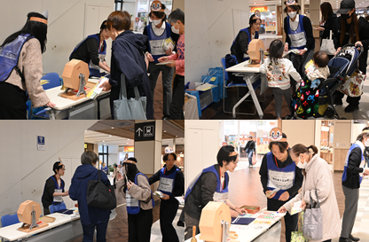 イベントの様子です。職員が府民にアンケートへの回答を促している様子。